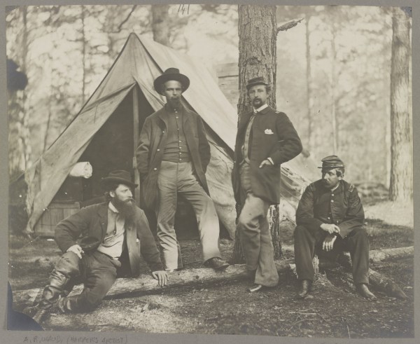 Captain Henry J. Sleeper, whom Lyman mentions in his November 15 letter, sits at the right in this photograph showing members of the 10th Massachusetts Battery. This was taken in December 1863. The man on the left is not a battery member--he is artist Alfred Waud (Library of Congress).