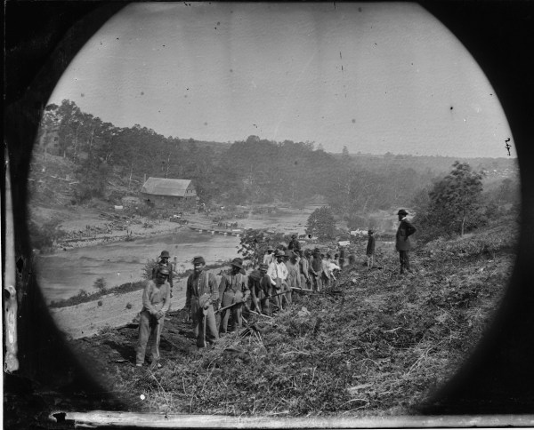 Another one of O'Sullivan's images from May 24. Of this one he said, "Jericho Mills, Va. Party of the 50th New York Engineers building a road on the south bank of the North Anna, with a general headquarters wagon train crossing the pontoon bridge" (Library of Congress).