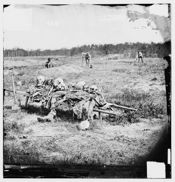 The costs of war. The remains of dead soldiers being collected at Cold Harbor after the war (Library of Congress).
