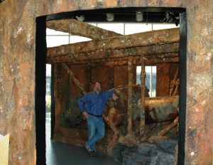I'm standing inside the recreation of the Monitor turret as it would have appeared on the seabed, when it was upside down and encrusted with marine life.